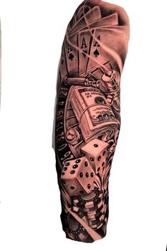 a man's arm with tattoos on it and some dices in the middle