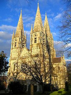 an old cathedral with spires on a sunny day