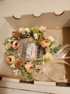 a box that has a wreath on it