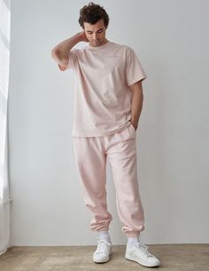 The Basics Lotus Unisex Sweatpant is made with our Premium Blend Fleece and is designed to be worn year-round, made to last.    Size: Model is 6'0" and wearing a size Large. Fit:  Relaxed, Unisex Fit Color:  Lotus Composition:  70% Cotton, 30% Polyester Features:  Super Soft, Pre-Shrunk, Hidden Drawcord,  Embroidered Logo on Left Leg Athleisure Pants With Double-needle Hem For Loungewear, Cotton Trousers Activewear For Loungewear, Cotton Lounge Activewear Trousers, Pink Joggers With Ribbed Cuffs For Jogging, Sportswear Bottoms With Relaxed Fit And Straight Hem, Relaxed Fit Sportswear Bottoms With Straight Hem, Pink Joggers With Ribbed Cuffs, Relaxed Fit Bottoms With Straight Hem For Sportswear, Pink Short Sleeve Activewear For Loungewear