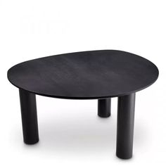 a black table sitting on top of a white floor