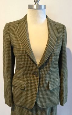 Classic, sharp and elegant....vintage woman suitBurberrys made in Englandin brown/green plaid Shetland tweed ....great fall colorsjacket features peak lapels and one-button front and 3 at cuff, full lining, fitted form, side pockets and small pocket at chest for scarf (note; that the suit has been clean but has some stains as you can see in pics), option to be creative with this AS IS. The skirt is mid calf, overlapping split at front, high waist, zipper w/hooks on side for closure, fully lined. Green Single-breasted Tweed Jacket For Fall, Fall Fitted Tweed Jacket, Green Fitted Tweed Blazer, Green Tweed Jacket For Fall Workwear, Fitted Tweed Jacket For Office In Fall, Fitted Plaid Tweed Wool Jacket, Tailored Green Tweed Jacket For Fall, Green Tweed Jacket For Fall, Fitted Tweed Blazer For Fall