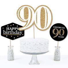 50th birthday cake toppers with gold glitter number 50 on it and white frosting