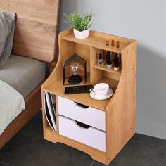 a bed with a wooden headboard next to a small shelf filled with bottles and other items