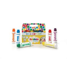 an assortment of children's crayons and toothpaste on a white background