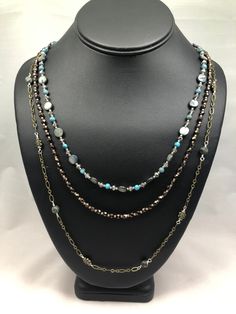 This beautiful handmade necklace features three beaded strands with a mix of Czech pressed glass beads and chain. All three strands are secured to an easy to connect lobster claw clasp with an antique bronze finish. A wonderful gift for the woman in your life, or that little something special to pick up on your self care day, this necklace is sure to dazzle and delight for any occasion, to truly make you The Belle of the Ball! Upper strand is 22''  Bottom strand is 26'' Self Care Day, Pressed Glass, Handmade Necklace, Bronze Finish, Something Special, Lobster Claw, Handmade Necklaces, Antique Bronze, Self Care