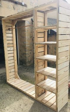 a wooden structure with shelves built into it