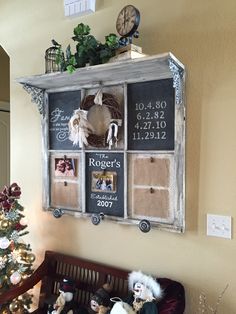 an old window is decorated with family photos and magnets