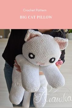 a crochet cat pillow sitting on top of a person's arm with the caption, crochet pattern big cat pillow