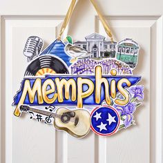 a door sign that says memphs with an image of a guitar and other things