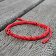 Adjustable bracelet Cotton Cord Casual Red Resizable Jewelry, Red Casual Wristband As Gift, Casual Red Wristband As Gift, Casual Red Wristband For Gift, Red Round Jewelry For Friendship, Round Red Jewelry For Friendship, Wrist Strap Bracelet Jewelry Gift, Casual Red Jewelry With Sliding Knot, Handmade Red Adjustable Wristband