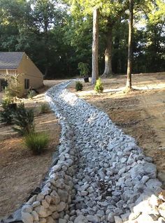 a stone path in front of a house