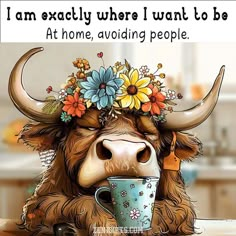 a cow with flowers on its head drinking from a cup