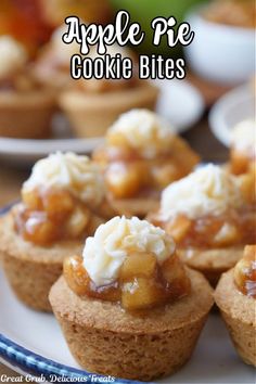 Cookie bites with apple pie filling and whipped cream sitting on a white plate. Mini Apple Pie Cookie Cups, Sugar Cookie Apple Pie Cups, Cherry Pie Cookie Cups, Sugar Cookie Mini Pies, Apple Pie Cookie Cups, Cups Desserts, Cookies Bites, Apple Pie Cookie, Cream Cheese Puffs