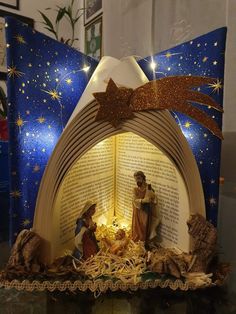 a nativity scene made out of an open book