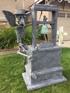 a cemetery with a skeleton and a bell on it