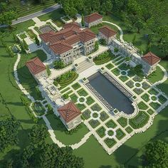 an aerial view of a large house in the middle of some trees and bushes,