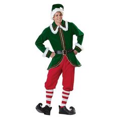 a man dressed in an elf costume standing with his hands on his hips