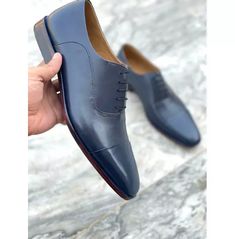 Introducing our Handmade Men's Navy Blue Leather Oxford Shoes, the epitome of sophistication and style. Crafted with utmost care and attention to detail, these dress shoes are a must-have for any gentleman who values quality and elegance. 
Made from genuine leather, these shoes exude luxury and durability. The upper is crafted from genuine leather, ensuring a soft and comfortable fit that molds to your feet over time. The lining is made from soft calf leather, providing a plush and luxurious feel with every step. The sole and heel are also crafted from genuine leather, further enhancing the overall quality and longevity of these shoes.
With a lace-up closure, these oxford shoes offer a secure and adjustable fit, allowing you to find the perfect fit for your feet. The hand-stitched detailin Mens Blue Dress Shoes, Navy Blue Dress Shoes, Blue Dress Shoes, Dress Shoes Mens, Men's Wedding Shoes, Cap Toe Shoes, Dress Shoes For Men, Navy Blue Shoes, Business Casual Shoes