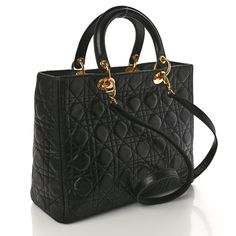 This is an authentic CHRISTIAN DIOR Lambskin Cannage Large Lady Dior in Black. This chic tote is structured of lambskin leather in black and has an attractive geometric embroidered quilted design. The bag has rolled leather top handles, polished gold links and a gold Dior charm. The top zipper opens to a red Dior monogram fabric interior. Large Lady Dior, Dior Monogram, Lady Dior, Lambskin Leather, Leather Top, Christian Dior, Dior, Handles, Monogram