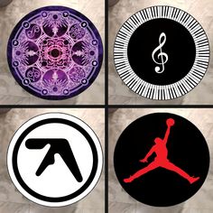 four circular stickers with different designs on them, each featuring a basketball player's silhouette