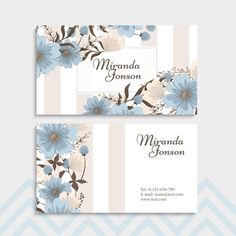 two business cards with blue flowers and leaves on the front, one has a white stripe background