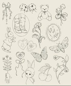 a bunch of drawings that are on top of a sheet of paper with animals and flowers