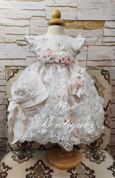 "★White Christening Gown, Baptism Dress★ ★Occasion: Baptism, Child Blessing or any Special Occasion ★Comes With: Dress, Bonnet and Headband ★Measurements 12-18 Months, (Long 21\") (Waist 20\")  (Shoulder to Shoulder 8.5\") 2 Years, (Long 21.5\") (Waist 21\")  (Shoulder to Shoulder 9\") 3 Years, (Long 24\") (Waist 23\")  (Shoulder to Shoulder 9.5\") 4 Years, (Long 26\") (Waist 24\")  (Shoulder to Shoulder 10\") -Waist measurement is around ★Features: The back is open, for comfort when you load the baby (The waist is adjustable, has two ribbons to make a bow, as in the photo) Please check the measurements, and any questions send me a message,  your satisfaction is very important for me Comes with a Dress Bag Dry Clean Only" Fitted Princess Baptism Dress With Floral Applique, Spring Princess Baptism Dress With Floral Applique, Fitted Baptism Dress With Floral Applique For Dress-up, Elegant Off-white Lace Baptism Dress, White Lace Trim Baptism Dress For Babies, Baby Girl White Dress, Baby Blessing Dress, Baby Birthday Dress, First Communion Decorations