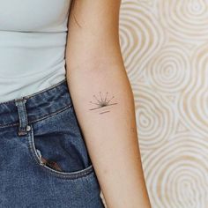 a person with a small tattoo on their arm