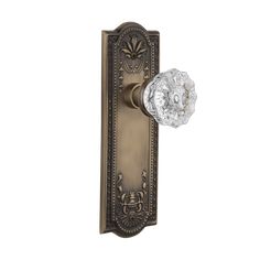 an antique style door handle with crystal glass knob