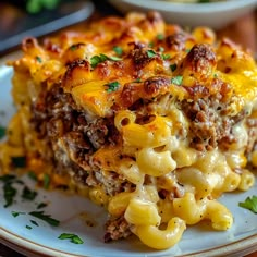 a close up of a plate of food with macaroni and cheese on it