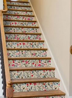 the stairs are decorated with floral wallpaper