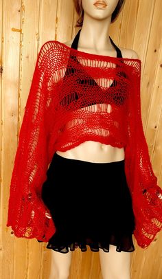 a mannequin wearing a red top and black skirt