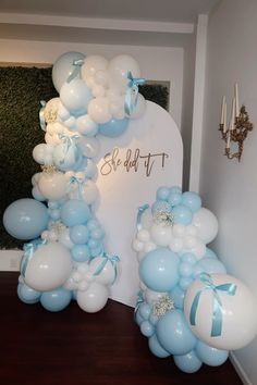 blue and white balloons are on display in front of a sign that reads, blvddt it