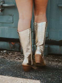 Stand out with style and confidence in our amazing Corkys Gold Metallic Cowgirl Boots! These bold boots are made with a dazzling gold metallic finish that will be sure to turn heads no matter if you're going to a gameday or your favorite concert. Make an unforgettable impression with Corkys! runs true to size 2 1/2" stacked wood heel Metallic Cowgirl Boots, Metallic Cowgirl, Wood Heel, Medium Dress, Small Dress, Cowgirl Boots, Gold Metal, Matter, Size 2