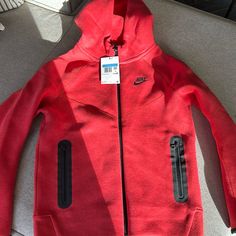 Kids Size M Brand New With Tags Red Hooded Hoodie For Outdoor, Red Sportswear Hoodie For Outdoor, Red Fleece Hooded Jacket With Adjustable Hood, Red Sportswear Winter Outerwear, Red Sportswear Outerwear For Winter, Red Hooded Sweatshirt For Outdoor, Red Sports Hoodie With Pockets, Red Fleece Hooded Sports Jacket, Red Sportswear Hoodie For Winter