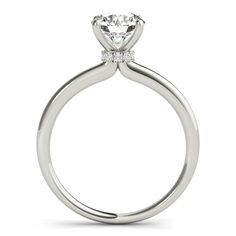 a white gold engagement ring with an oval shaped diamond