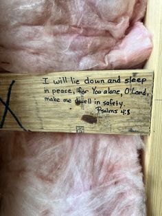 a wooden sign that says i will lie down and sleep in peace