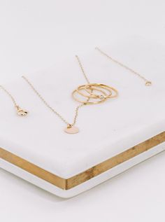 Our Reflection Necklace is made of all 14k gold-filled materials. Durable, yet dainty. Classic, yet on trend. This simple design means the light catches it justttt right. our best-selling necklace Handmade 14-karat Gold-filled Wire Hypoallergenic Non-tarnish 16” chain Hot tip: the Reflection Necklace layers great with an 18" necklace Learn more about our metals & materials Staple Pieces, Delicate Necklace, Layered Necklaces, Handmade Necklaces, Simple Designs, Gold Filled, Gold Necklace, Chain, Sterling Silver