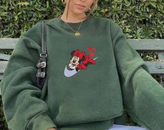 Mickey Valentine’s Day Embroidered Sweatshirts If you wish another color besides our color chart, you can note on Order Notes at checkout.  We do not accept returns or exchanges, but please message us if anything is wrong with your order! 📌 PRODUCT DESCRIPTION 📌SIZE:For the detailed sizing information, please check out the sizing chart under the photos to find the right size for you! All sweatshirts are adult unisex. If you have any questions on sizing, please contact me before placing your or Disneyland Sweatshirt, Kids Disney Shirts, Disneyland Shirt, Family Disney Trip, Embroidered Polo Shirts, Mickey Mouse Sweatshirt, Disney Family Vacation, Disneyland Shirts, Disney World Shirts