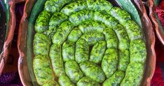 green beans in a bowl on display at a market