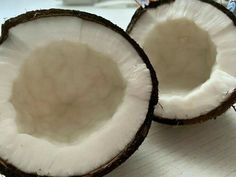 two halves of coconuts sitting on top of a table