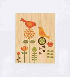 a wooden card with birds and flowers on it