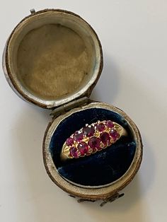 Very pretty Edwardian natural ruby boat ring set with mixed cut natural rubies and set in 18ct yellow gold, the date letter is for 1910 and it was made in Chester. In lovely antique condition with very clear hallmark. This is a listing just for the two row boat ring the other rings at time of publishing are in the shop and available as other listings, this is for the 10 stone natural ruby ring. Size UK Q. Ruby Vintage Ring, Antique Gold Ruby Ring As Gift, Vintage Ruby Engagement Ring, Victorian Style 14k Gold Ruby Ring Gift, Edwardian Ruby Ring, Luxury Handmade Antique Ruby Ring, Ruby Engagement Ring Vintage, Victorian Gold Ruby Ring With Multi-stone, Antique Ruby Ring