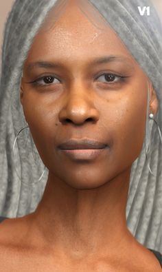 a woman with grey hair and large hoop earrings on her head is looking at the camera