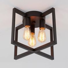 an image of a light fixture with three bulbs on it and one bulb in the center