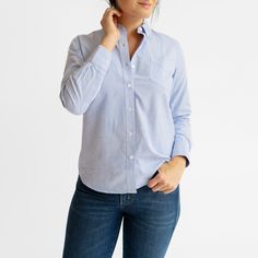 The Blue Oxford shirt is one of the most timeless and versatile pieces in the service industry, able to be dressed up with a blazer, or down with jeans and sneakers. The updated and upgraded version of our Service Oxford features an equally durable but much softer 75/25 cotton poly blend, as well as cleaner stitching, a crisper collar, and an improved fit. Features: Button-down collar, clean finished seams Material: 75% Cotton, 25% Polyester, 4oz Blue Oxford Cloth Fit: Model is 6'0"/170 lbs, wea Blue Shirt For Business Casual In Fall, Light Indigo Tops With Button Closure For Workwear, Blue Tops With Welt Pockets For Spring, Unstructured Washed Blue Tops For Work, Unstructured Washed Blue Top For Work, Light Indigo Relaxed Fit Shirt For Work, Washed Blue Spring Shirt For Work, Unstructured Washed Blue Shirt For Work, Spring Light Indigo Workwear Shirt