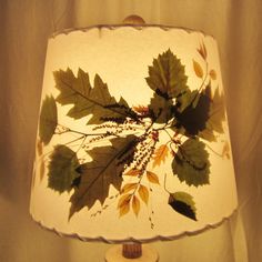 a lamp that has leaves on it