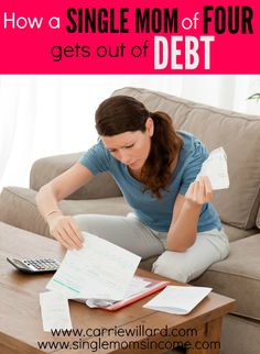 a woman sitting on the couch with her calculator and paperwork in front of her