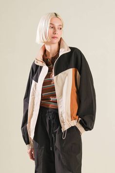 A woven color block windbreaker Details: Self: 100% NylonContrast 1: 100% NylonContrast 2: 100% Nylon Size & Fit - Model is 5`8" And Wearing Size Small- Measurements Taken From Size Small- Approx. Length: 24" Cheap Retro Windbreaker For Sports, Casual Fall Windbreaker With Contrast Color, Casual Windbreaker With Contrast Color For Fall, Casual Contrast Color Windbreaker For Fall, Spring Nylon Outerwear With Patchwork, Patchwork Track Jacket For Fall Outdoors, Patchwork Track Jacket For Outdoor Fall Activities, Fall Season Patchwork Track Jacket For Outdoor, Casual Track Jacket With Contrast Color For Fall